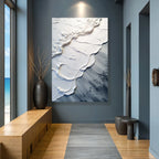 Abstract white and gray textured wall art in modern hallway with ocean view, perfect for living space decor