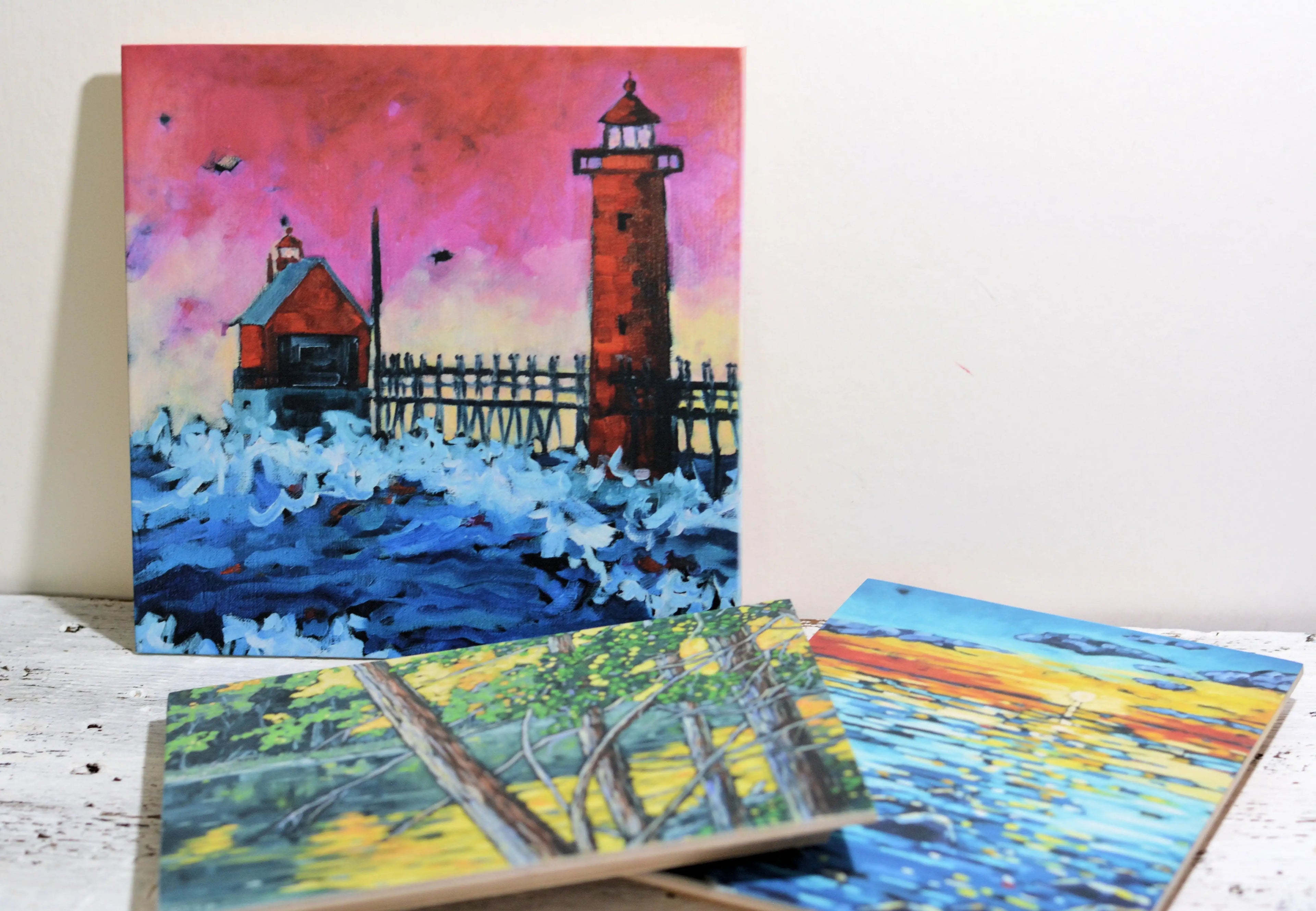 Vivid lighthouse painting with pink sky, blue waves, and coastal scene, perfect for home wall art decor.