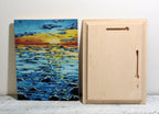 Vivid sunset seascape painting with wooden frame, perfect for home wall art decor